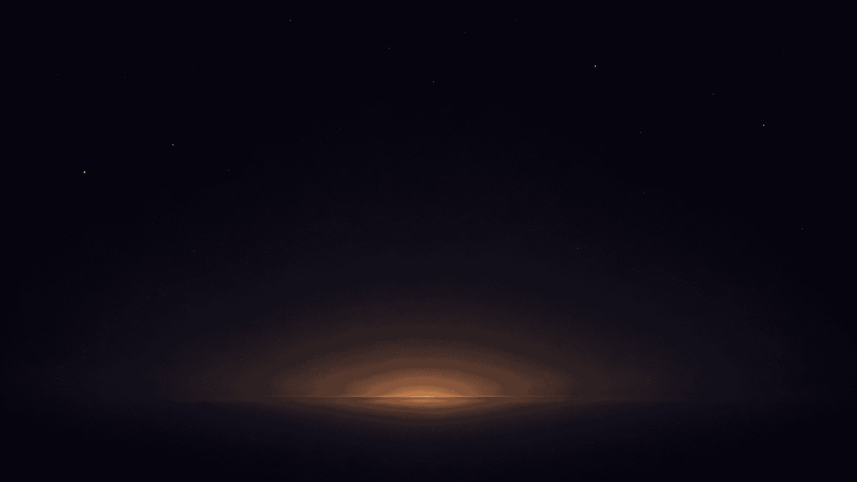 A dark night sky with a faint glow of light on the horizon